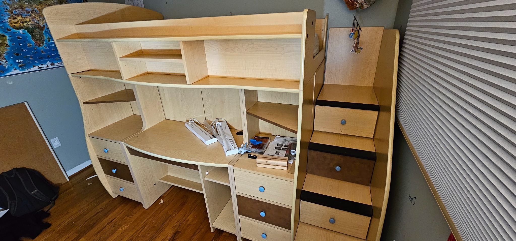 Reassembled wooden loft bed with desk and stairs
