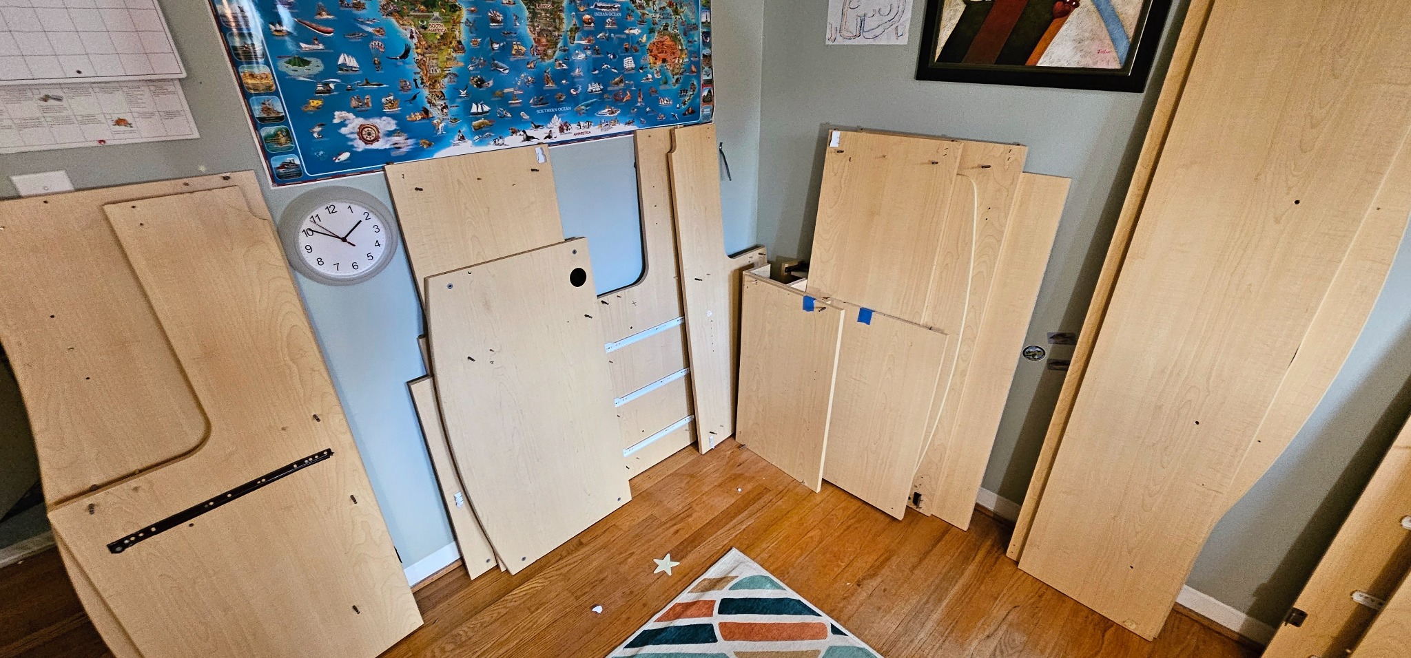 Loft bed panels and parts staged before reassembly