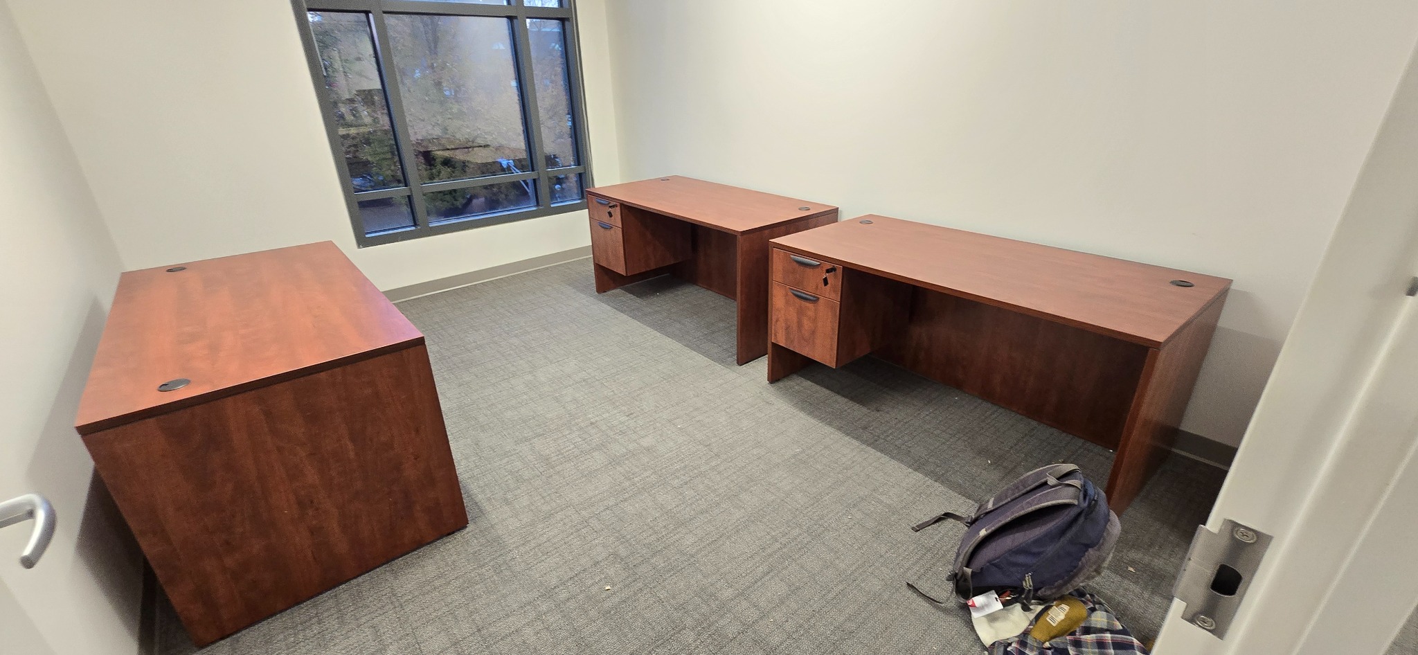 Three assembled wood office desks